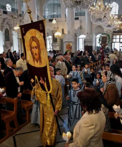 FILE - In this Sunday, April 15, 2012 file photo, Syrian Orthodox Christians attend Easter mass in Damascus, Syria. Christians, who make up about 10 percent of Syria's population of more than 22 million, say they are particularly vulnerable to the violence that has been sweeping the country since March 2011. They are fearful that Syria will become another Iraq, with Christians caught in the crossfire between rival Islamic groups. (AP Photo/Bassem Tellawi, File)